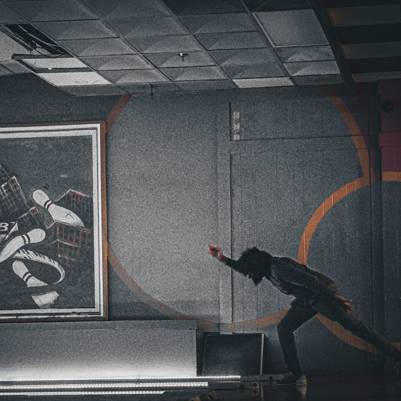 A side view of a man bowling